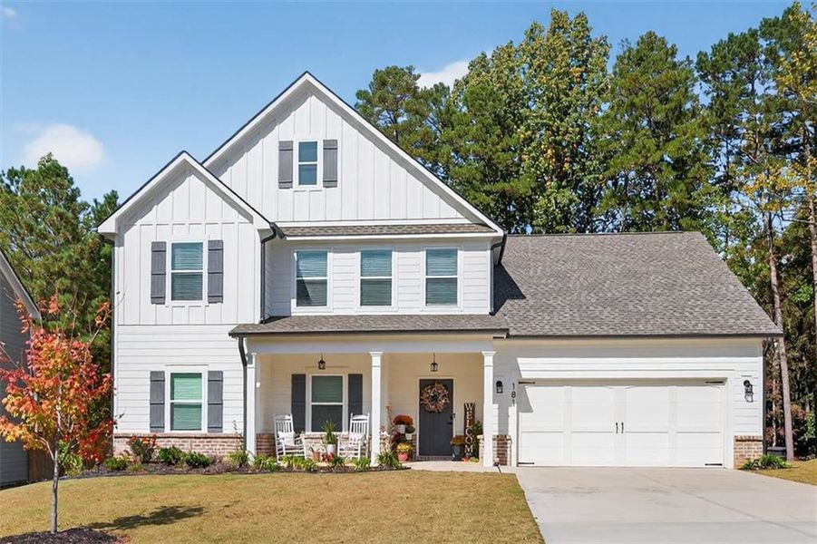 Front exterior of a new home in Calgary Downs, Winder, GA, highlighting curb appeal (Image 25). Front exterior of a new home in Calgary Downs, Winder, GA, highlighting curb appeal (Image 25).