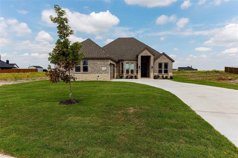 Front exterior of a new home in , Venus, TX, highlighting curb appeal (Image 16).