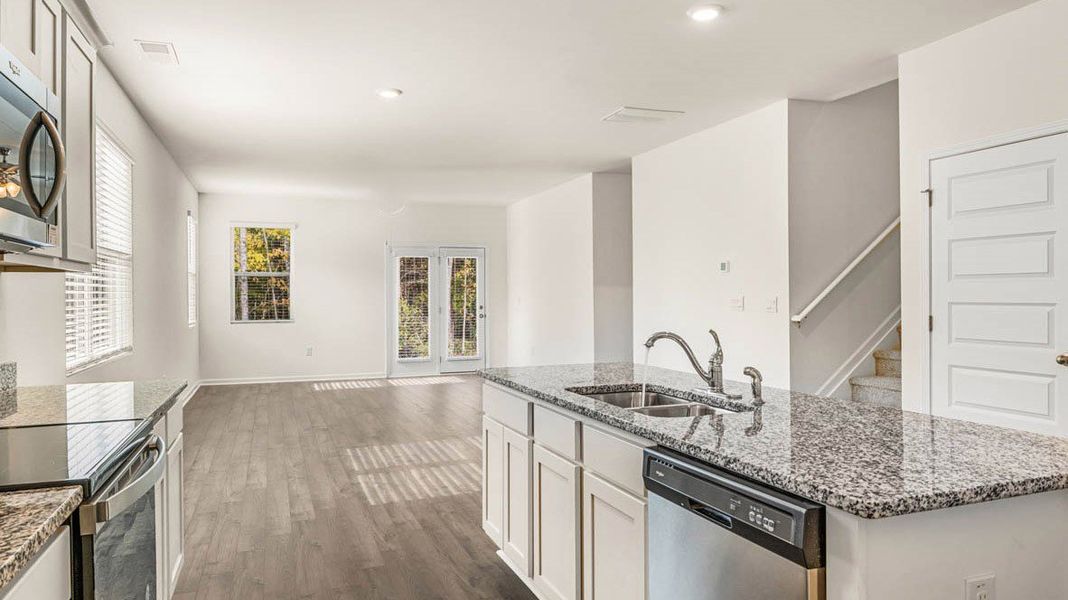 Representative furnished interior of a home built from the Dennis by D.R. Horton in Glenmaye, Hampton (Image 9).