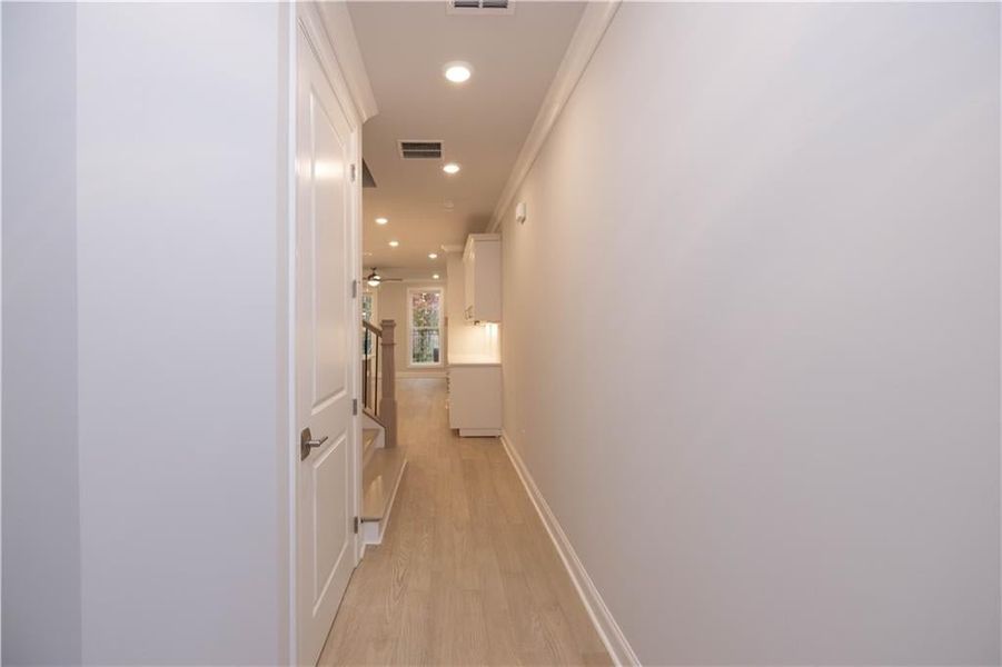 Corridor with light wood-type flooring