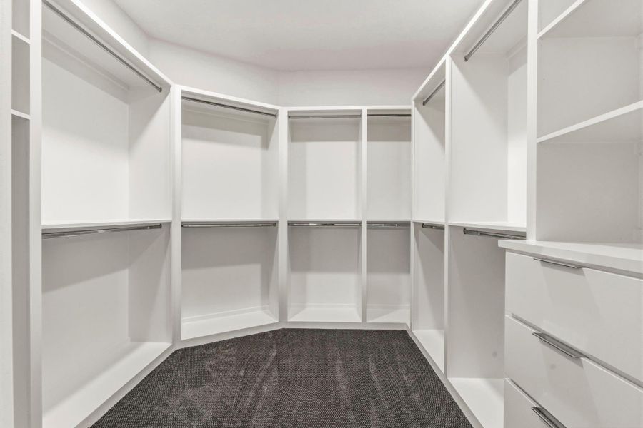 Custom built shelves in both primary closets