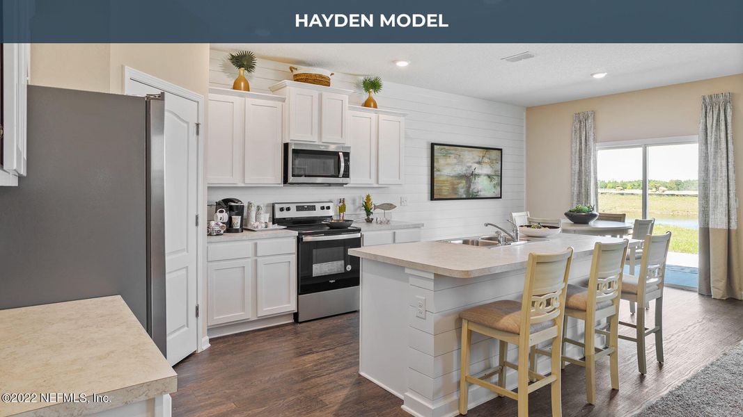 Furnished interior view inside a new home in Cross Creek Express, Green Cove Springs (Image 24).