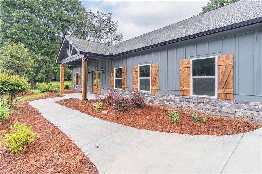 Front exterior of a new home in , Braselton, GA, highlighting curb appeal (Image 23).