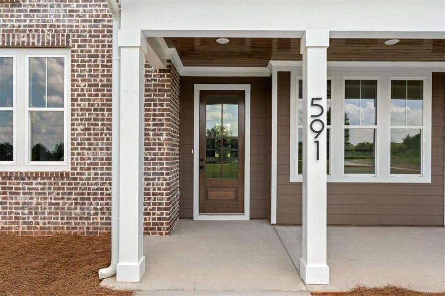 Exterior details and patio area of a home in , Roopville (Image 4).