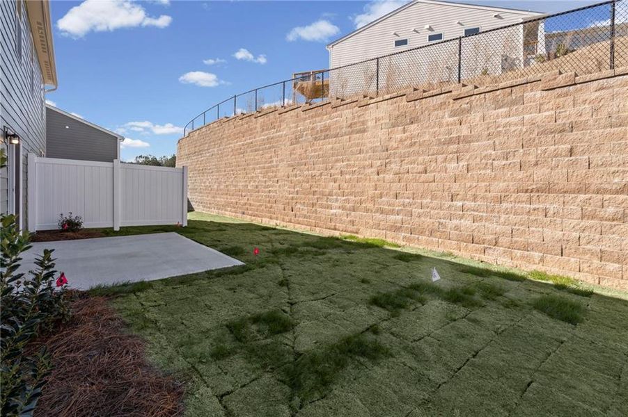 Exterior details and patio area of a home in Villas at Gold Creek, Dawsonville (Image 24).