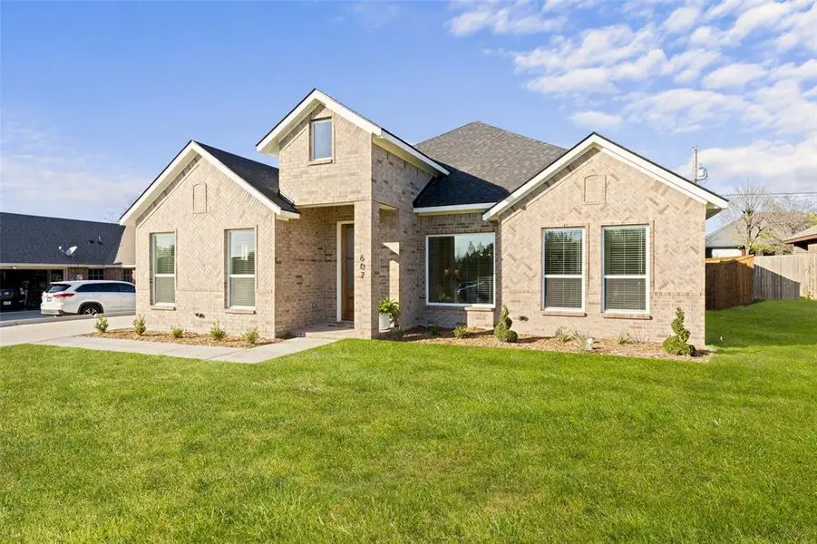 Front exterior of a new home in , Glenn Heights, TX, highlighting curb appeal (Image 2). Front exterior of a new home in , Glenn Heights, TX, highlighting curb appeal (Image 2).
