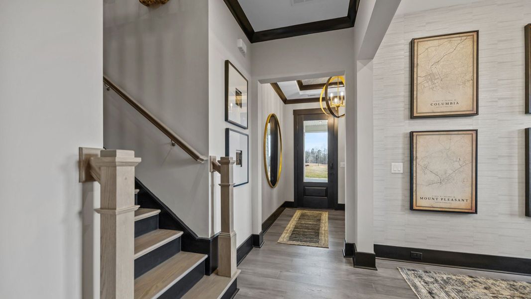 The Enthusiast Plan by DBR Homes a bright and welcoming home entryway in Fort Mill, SC