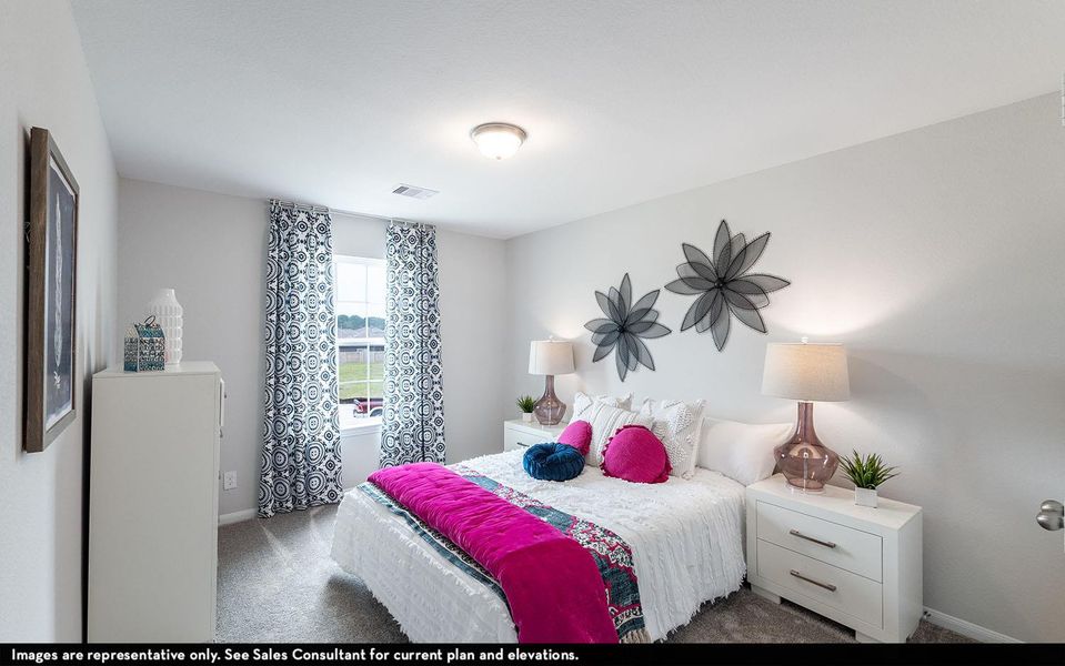 Carpeted bedroom with baseboards