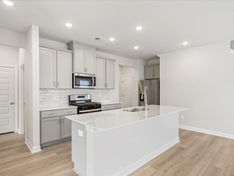 Furnished interior view inside a new home in Waterside - Boardwalk Series, Longs (Image 3).