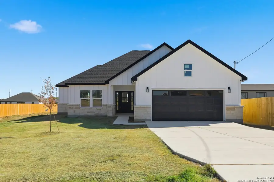 Front exterior of a new home in , Atascosa, TX, highlighting curb appeal (Image 2).