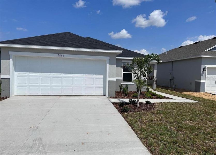 Front exterior of a new home in , Davenport, FL, highlighting curb appeal (Image 1). Front exterior of a new home in , Davenport, FL, highlighting curb appeal (Image 1).