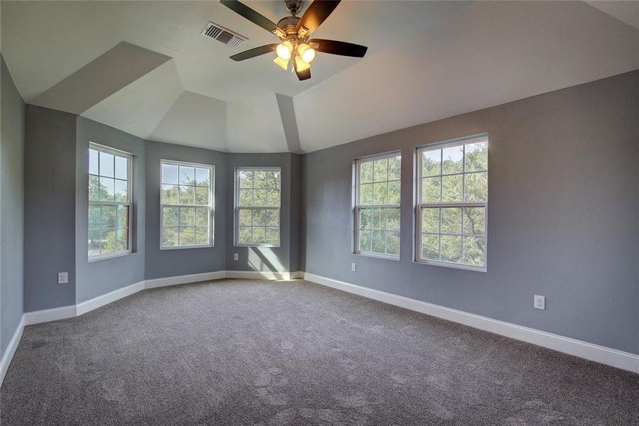 Bedroom 2 with colored carpet and ceiling fan