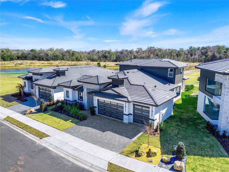 Front exterior of a new home in Hampton Green at Providence, Davenport, FL, highlighting curb appeal (Image 28).