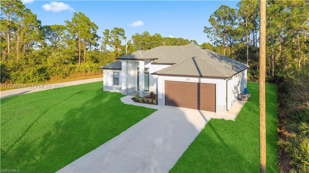 Front exterior of a new home in , Lehigh Acres, FL, highlighting curb appeal (Image 28).