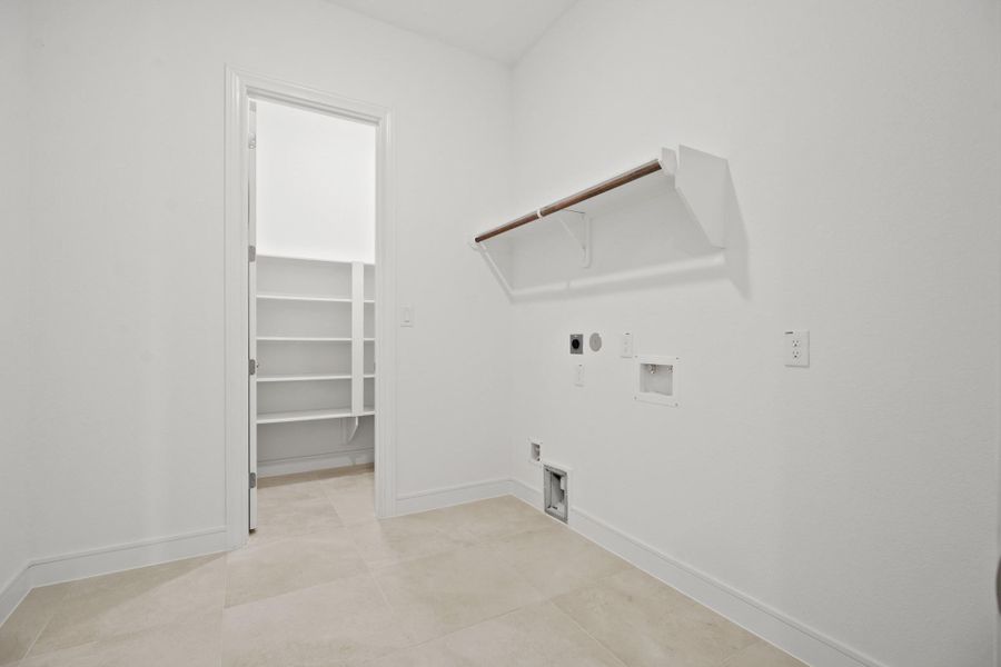 Laundry room with extra storage (*Photo not of actual home and used for illustration purposes only.) Laundry room with extra storage (*Photo not of actual home and used for illustration purposes only.)