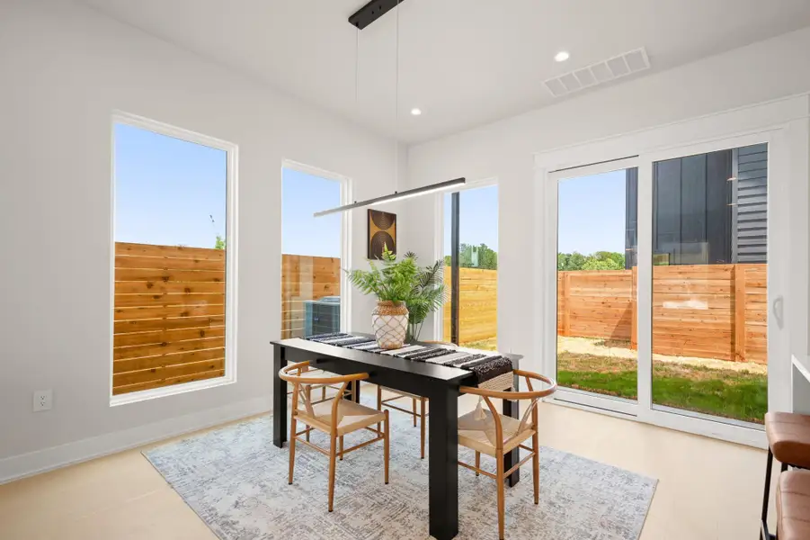 Dining room featuring plenty of natural light and recessed lighting