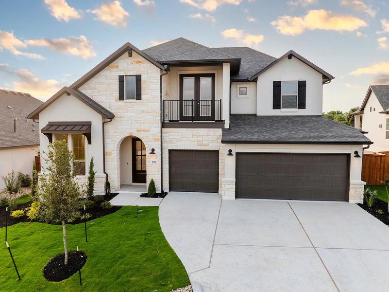 Front exterior of a new home in Caliterra - 70', Dripping Springs, TX, highlighting curb appeal (Image 2). Front exterior of a new home in Caliterra - 70', Dripping Springs, TX, highlighting curb appeal (Image 2).
