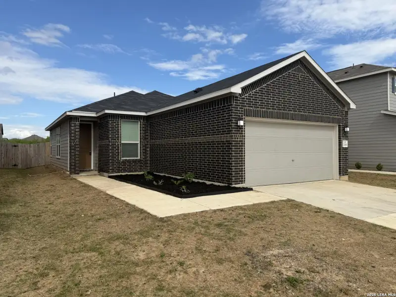 Front exterior of a new home in Marbella, San Antonio, TX, highlighting curb appeal (Image 2). Front exterior of a new home in Marbella, San Antonio, TX, highlighting curb appeal (Image 2).