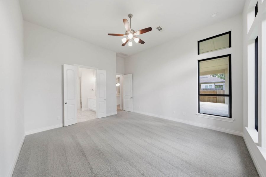 Spacious, unfurnished interior of a new home in The Woodlands Hills 65′, Willis (Image 37).