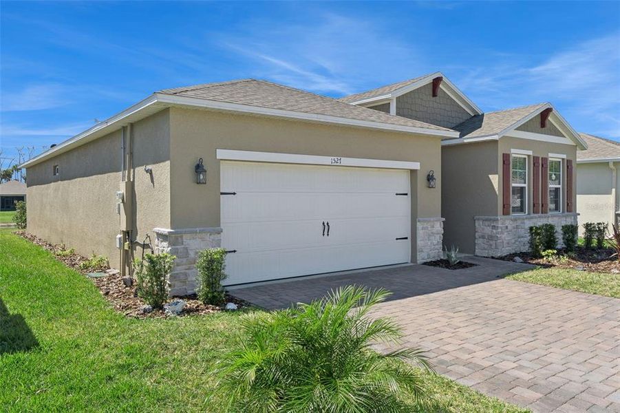 Front exterior of a new home in , New Smyrna Beach, FL, highlighting curb appeal (Image 22).