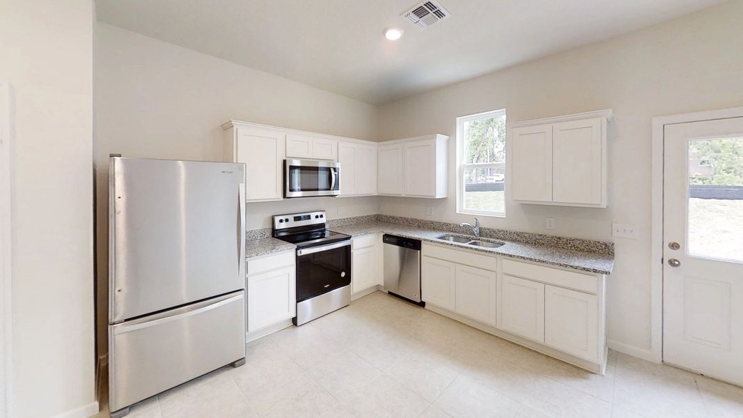 Representative furnished interior of a home built from the Endeavor by Starlight Homes in Pelham Square, Deland (Image 4).