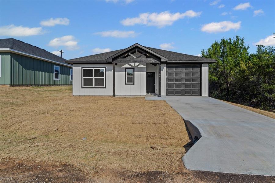 Front exterior of a new home in , Granbury, TX, highlighting curb appeal (Image 23).