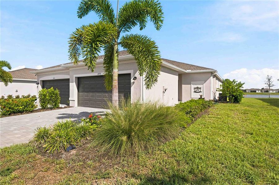 Front exterior of a new home in , Englewood, FL, highlighting curb appeal (Image 26). Front exterior of a new home in , Englewood, FL, highlighting curb appeal (Image 26).