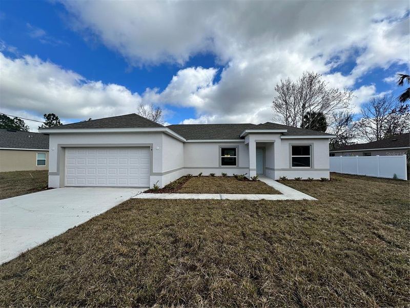 Front exterior of a new home in Palm Coast: Cornerstone Collection, Palm Coast, FL, highlighting curb appeal (Image 1).