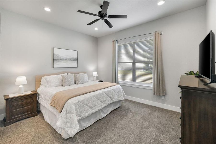 Bedroom with carpet, recessed lighting, and a ceiling fan