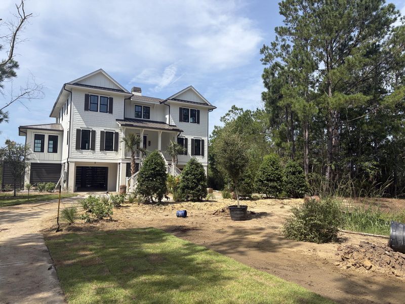 Front exterior of a new home in , Awendaw, SC, highlighting curb appeal (Image 13).