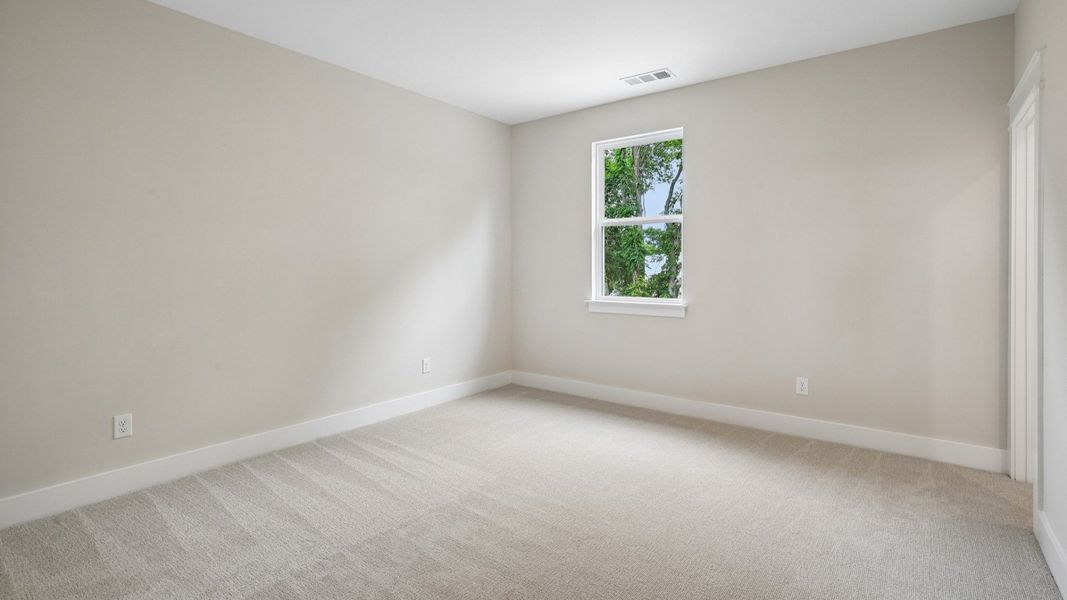 Bedroom with carpet and window Bedroom with carpet and window