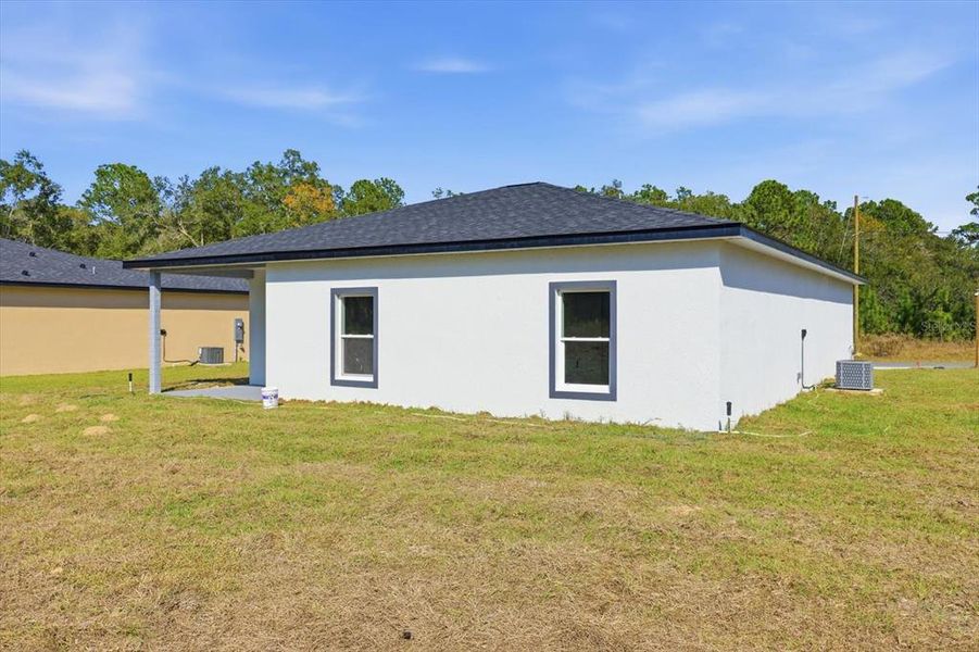 Exterior details and patio area of a home in , Citrus Springs (Image 24).