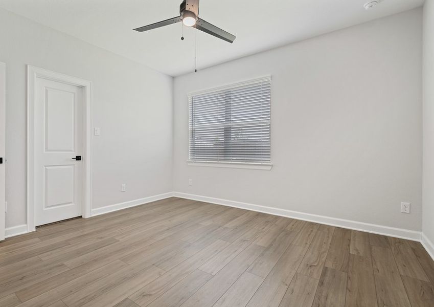 Master bedroom with a large window