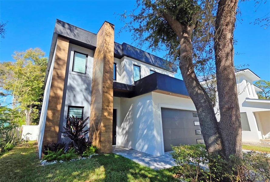 Front exterior of a new home in , Sarasota, FL, highlighting curb appeal (Image 31).