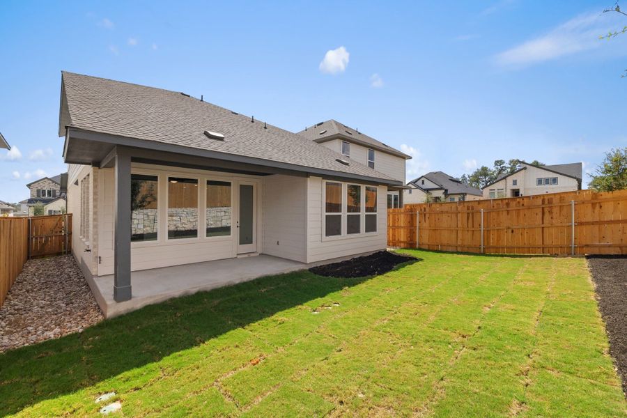 Exterior details and patio area of a home in Heritage, Dripping Springs (Image 29).