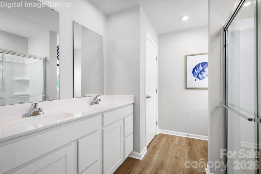 Primary Bathroom Designed With You in Mind - Spa-Inspired Shower and Dual Vanities - Every Detail Caters to Your Daily Routine and Quiet Moments of Indulgency.