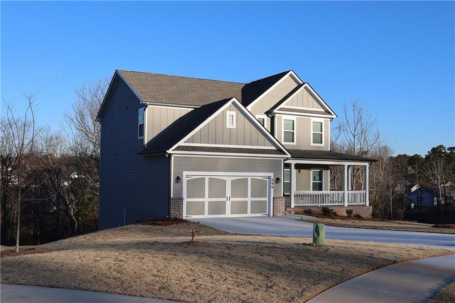 Front exterior of a new home in Calgary Downs, Winder, GA, highlighting curb appeal (Image 15).