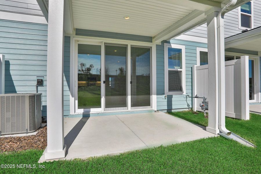Exterior details and patio area of a home in Brook Forest - Townhomes, St. Augustine (Image 27).