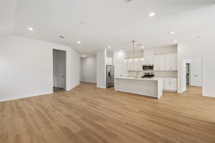 Laundry room and garage access through the shown hall to the left.