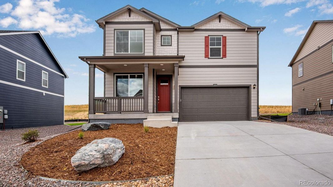 Front exterior of a new home in Sky Ranch, Watkins, CO, highlighting curb appeal (Image 20).