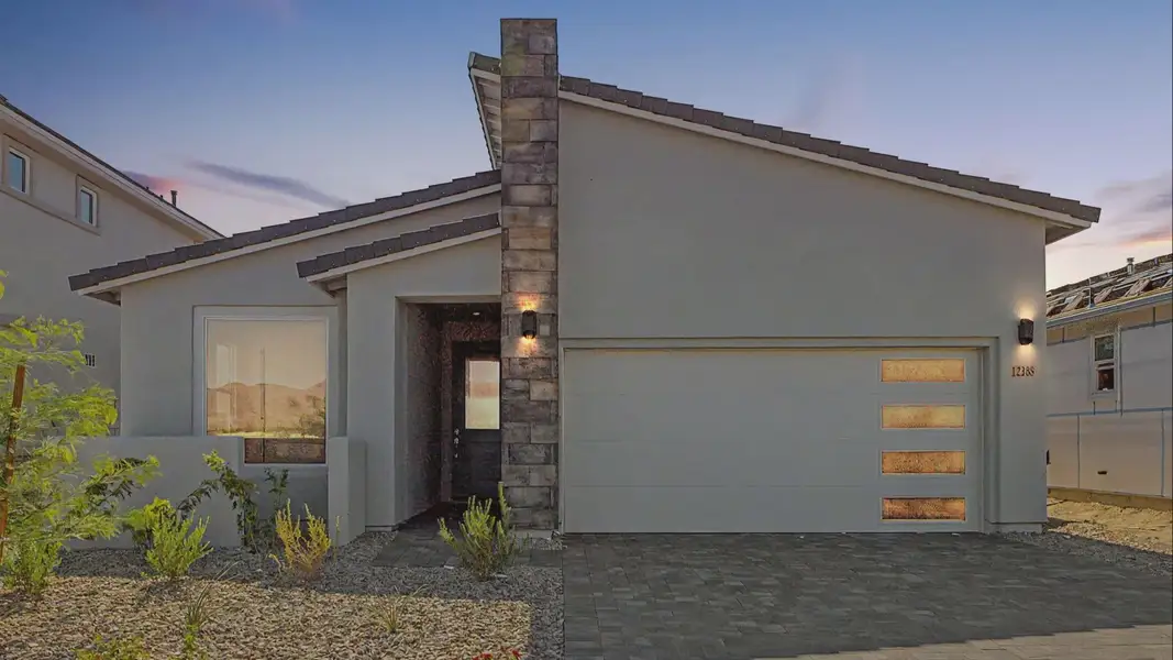 Front exterior of a new home in Teravalis, Buckeye, AZ, highlighting curb appeal (Image 1). Front exterior of a new home in Teravalis, Buckeye, AZ, highlighting curb appeal (Image 1).