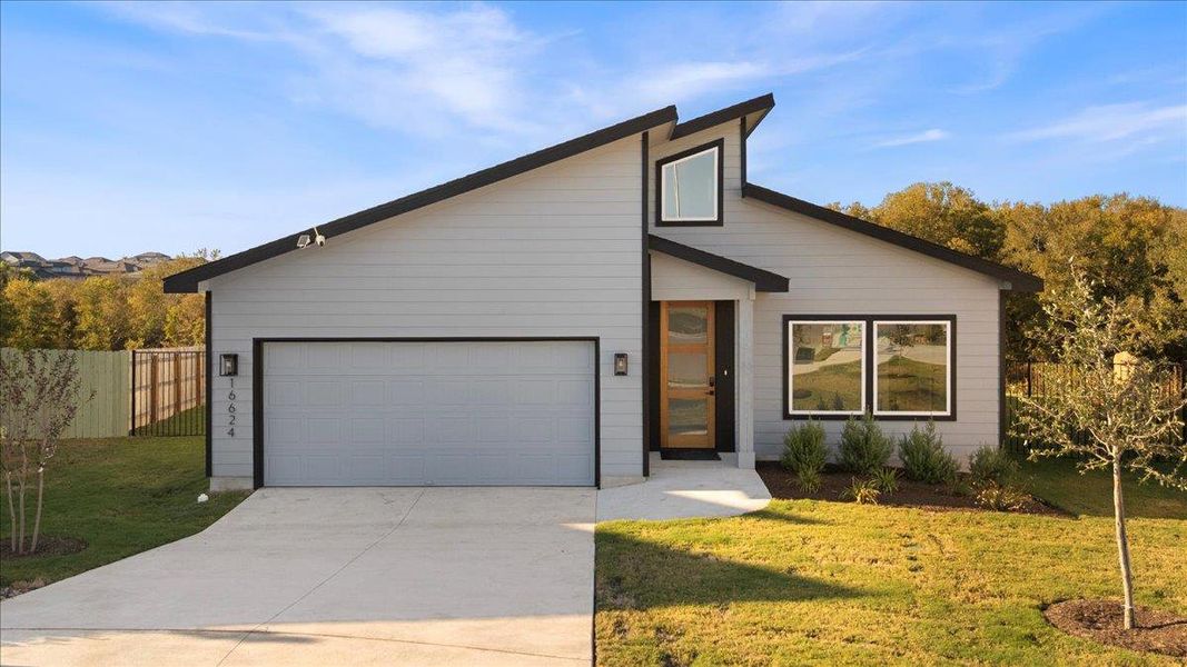 View of front of home featuring concrete driveway and a garage View of front of home featuring concrete driveway and a garage