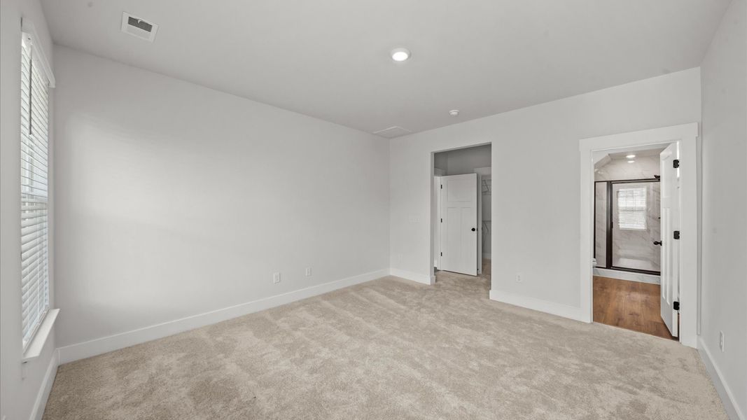 Accomplished design meets restful elegance in this exclusive primary suite by DRB Homes