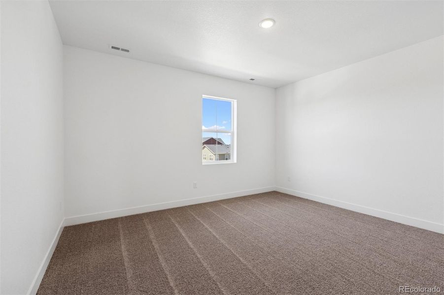 Spacious, unfurnished interior of a new home in Painted Prairie Cottage, Aurora (Image 19).