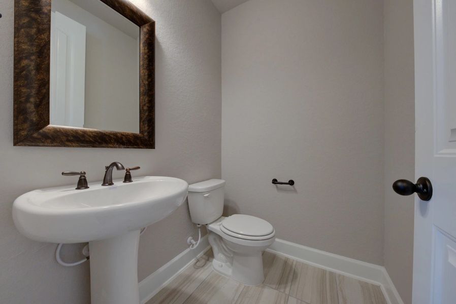 Representative furnished interior of a home built from the Barnett by Ashton Woods in Sunday Creek at Kinder Ranch, San Antonio (Image 6).
