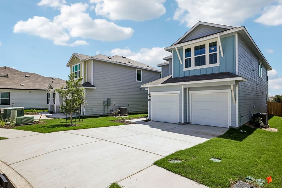 Front exterior of a new home in Edgebrooke, Pflugerville, TX, highlighting curb appeal (Image 16). Front exterior of a new home in Edgebrooke, Pflugerville, TX, highlighting curb appeal (Image 16).