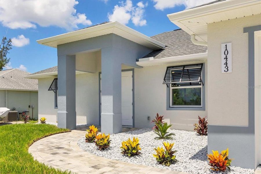 Front exterior of a new home in , Port Charlotte, FL, highlighting curb appeal (Image 20). Front exterior of a new home in , Port Charlotte, FL, highlighting curb appeal (Image 20).