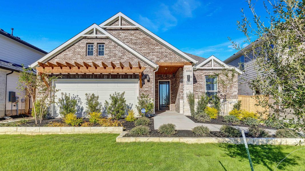Representative exterior photo of a completed home built from the Palm by DRB Homes in Oaks at San Gabriel, Georgetown, TX (Image 23).