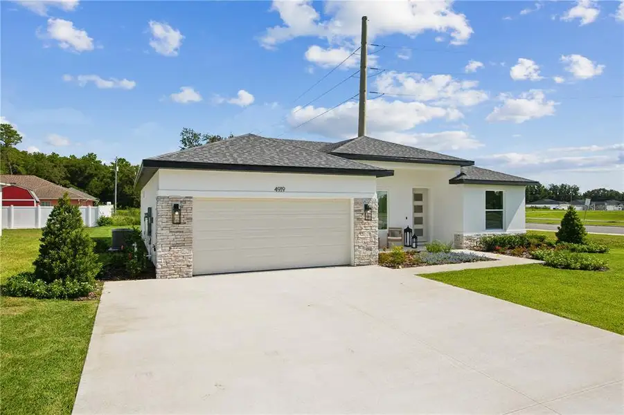 Front exterior of a new home in , Palm Coast, FL, highlighting curb appeal (Image 2). Front exterior of a new home in , Palm Coast, FL, highlighting curb appeal (Image 2).