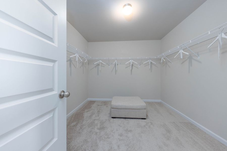 Oversized walk-in closet in primary bedroom